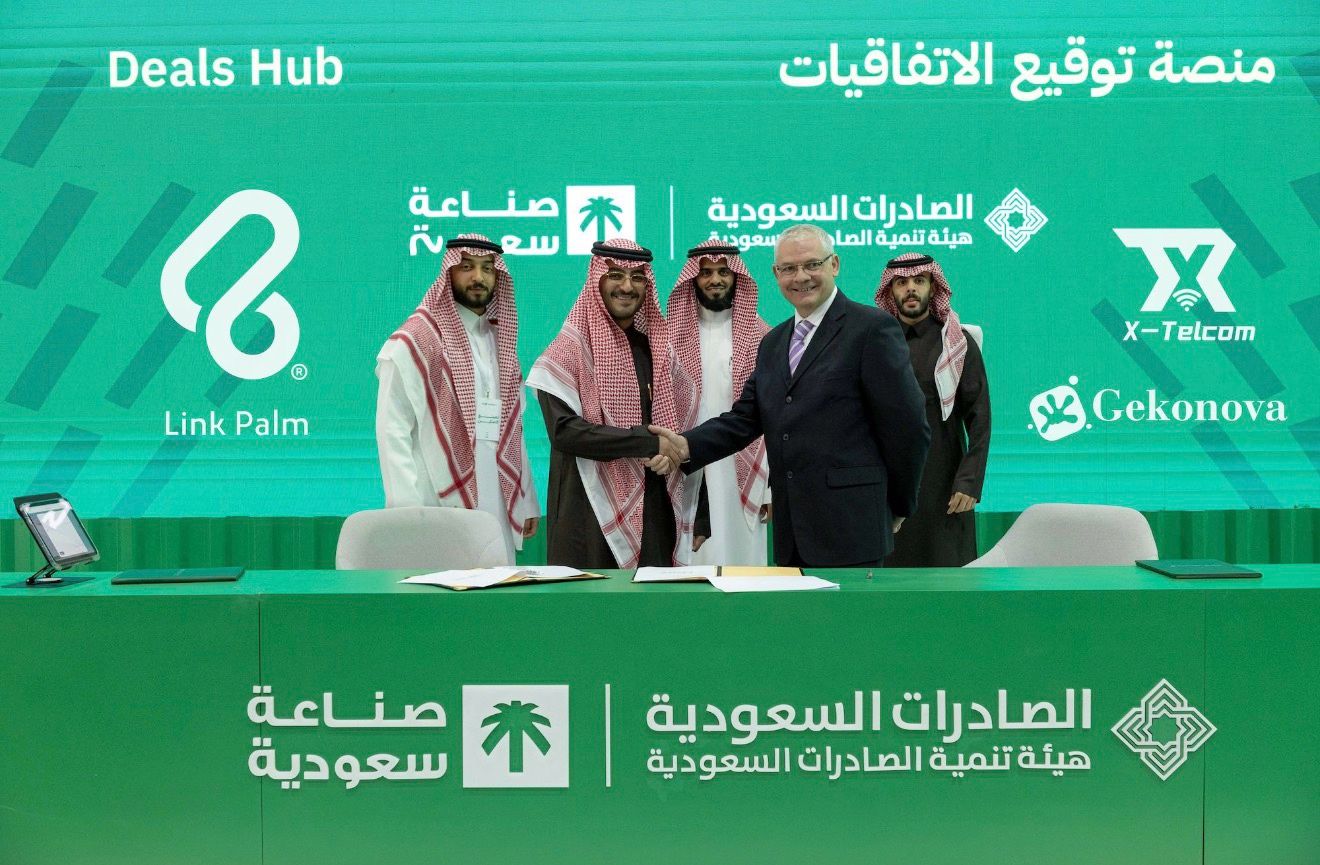 Gekonova and X-Telcom executives shaking hands with NovaPay representatives during the official partnership signing at the Made in Saudi event in Riyadh, marking a major palm vein payment agreement.
